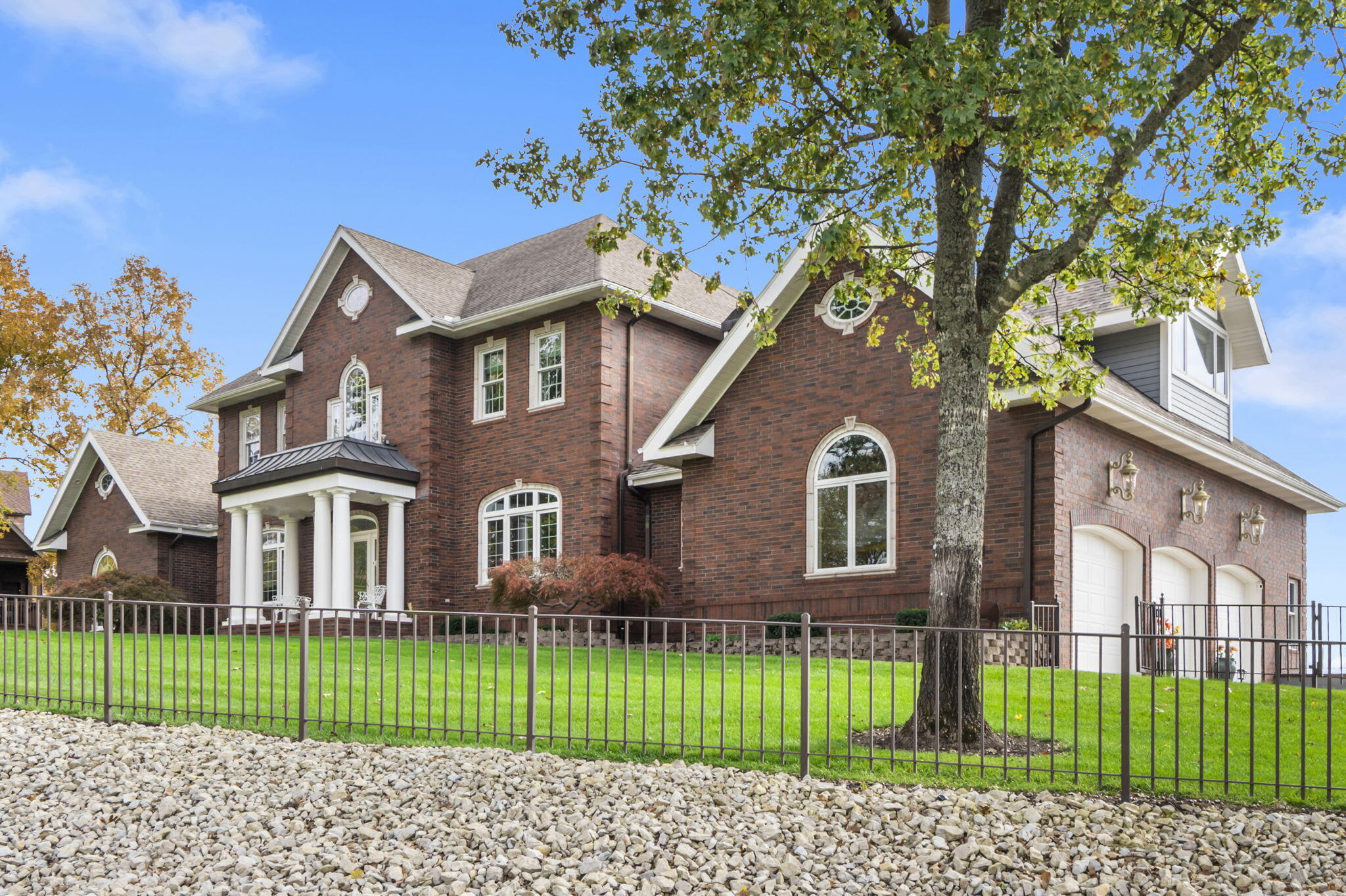 Front of Home with 3 car garages