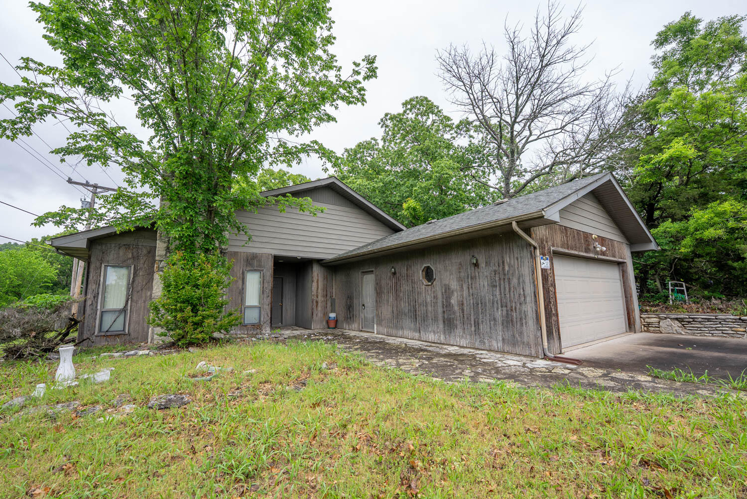 Fixer upper on 2.79 acres with a lake vi